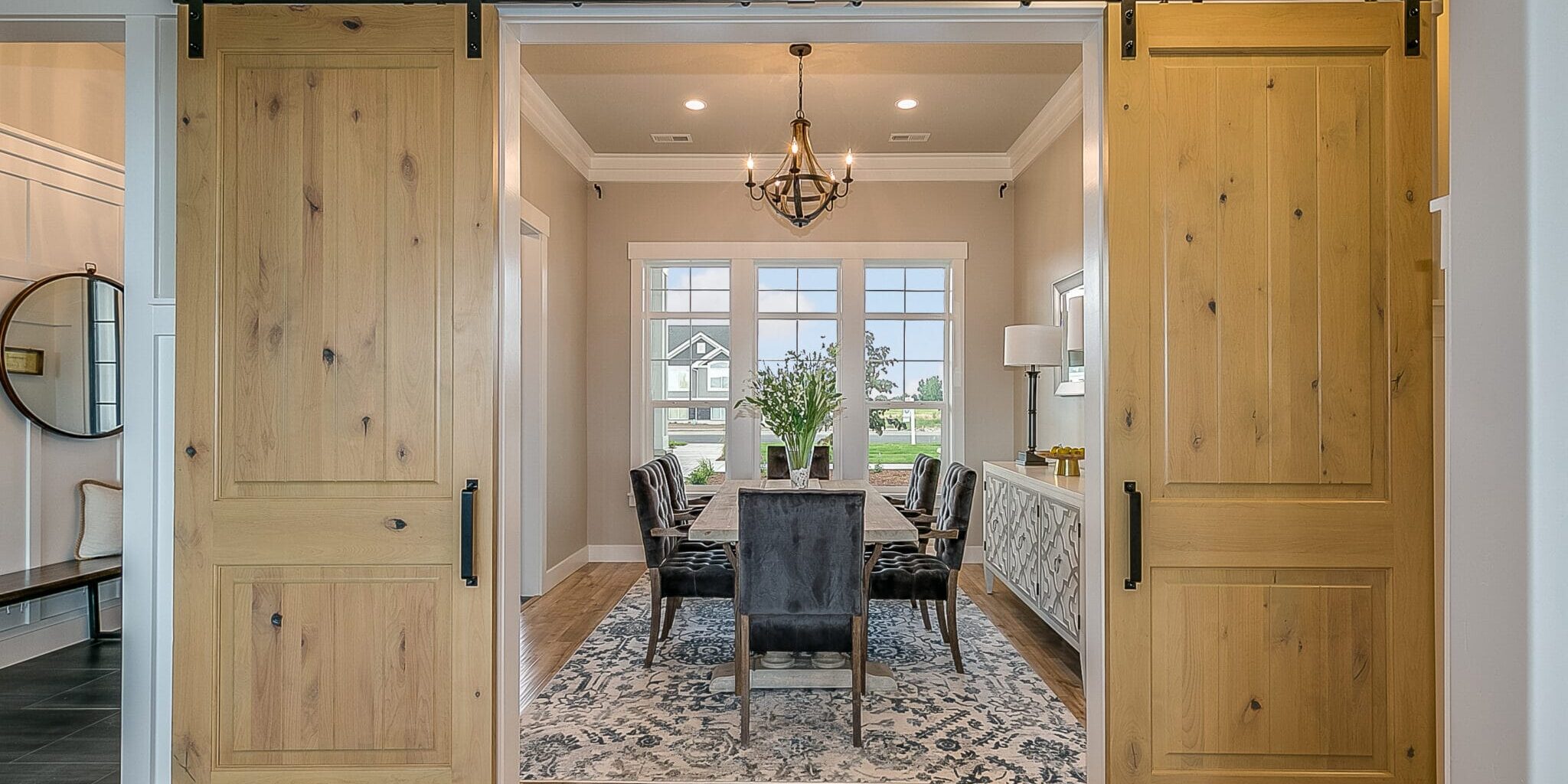 Beautiful wood barn doors and hardwood flooring give an elegant but down to earth type of feel