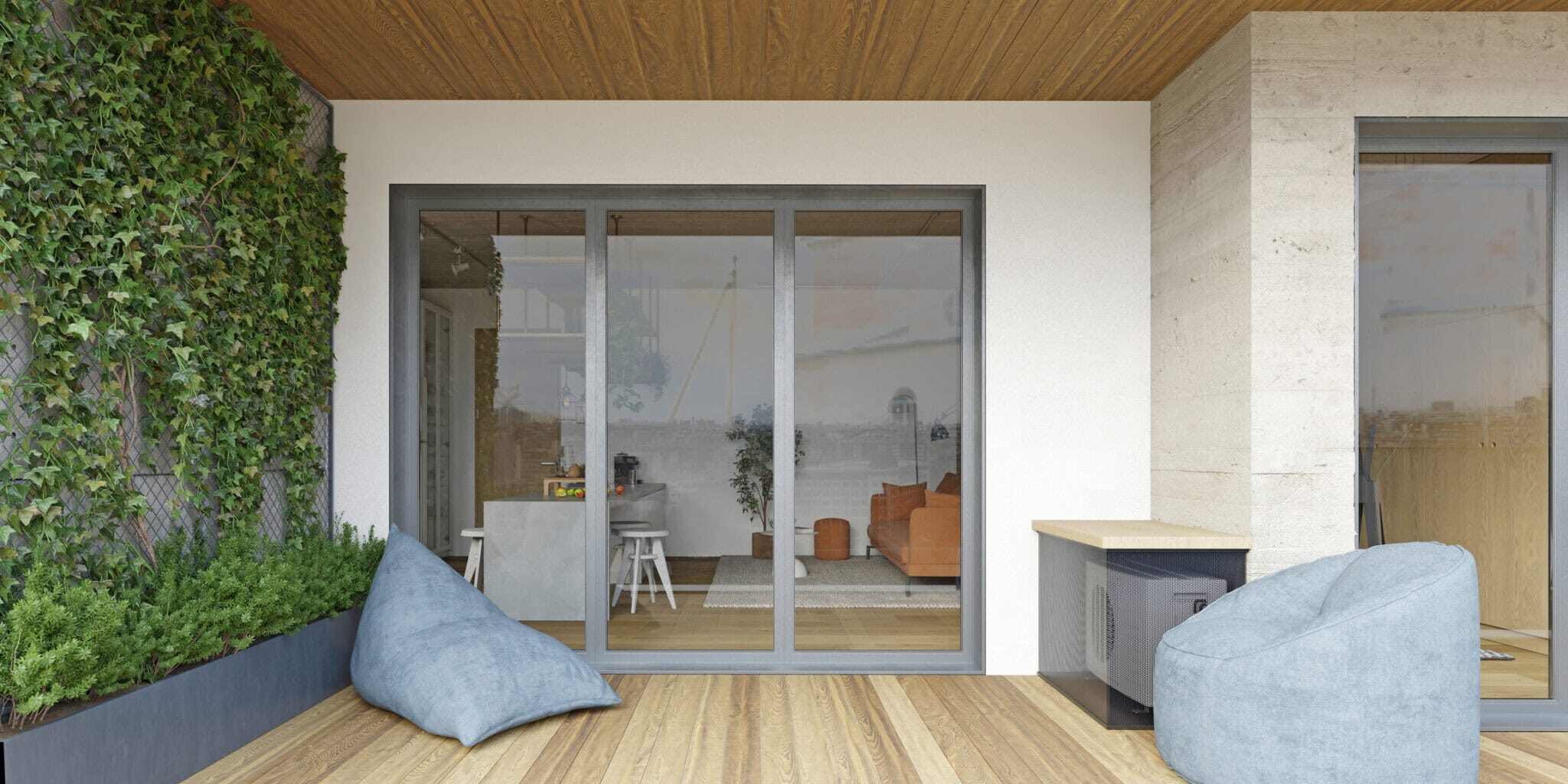 A photorealistic 3D rendering of a modern apartment balcony featuring a wooden deck floor and ceiling. Two light blue beanbag chairs sit on the terrace, offering a relaxation spot. To the left, a vertical garden with ivy climbs a trellis above a planter box filled with greenery. Large glass sliding doors reveal the interior living space, which includes a kitchen island with stools, a sofa, and modern decor. An air conditioning unit is concealed within a mesh enclosure on the right. The scene is illuminated by natural daylight.